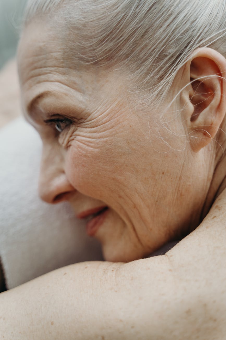 close up photograph of an elderly woman with freckles
